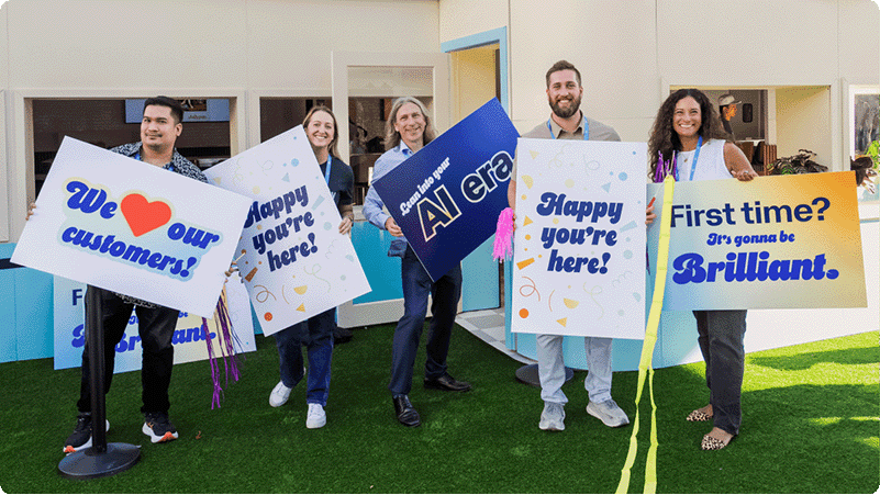 Workday Rising attendees with signs